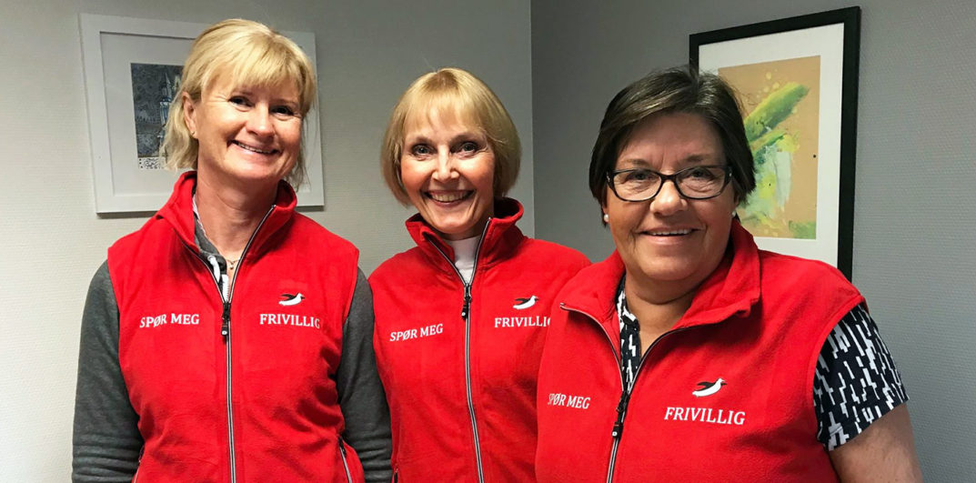 En gruppe kvinner som smiler