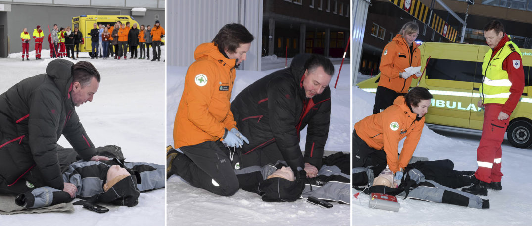 En gruppe mennesker i oransje jakker