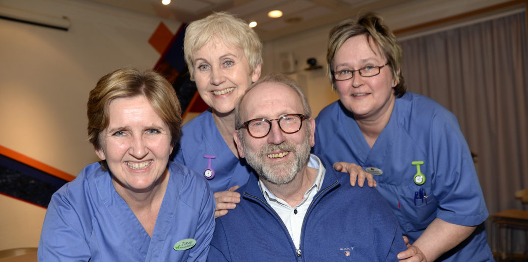 En gruppe mennesker som poserer for kameraet