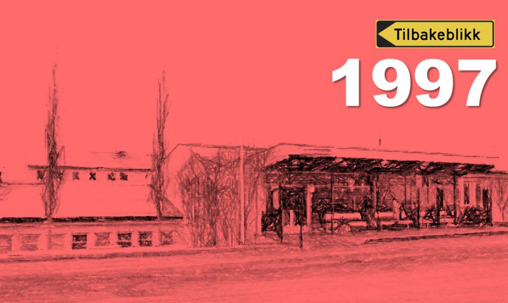 Et rødt og hvitt skilt med trær