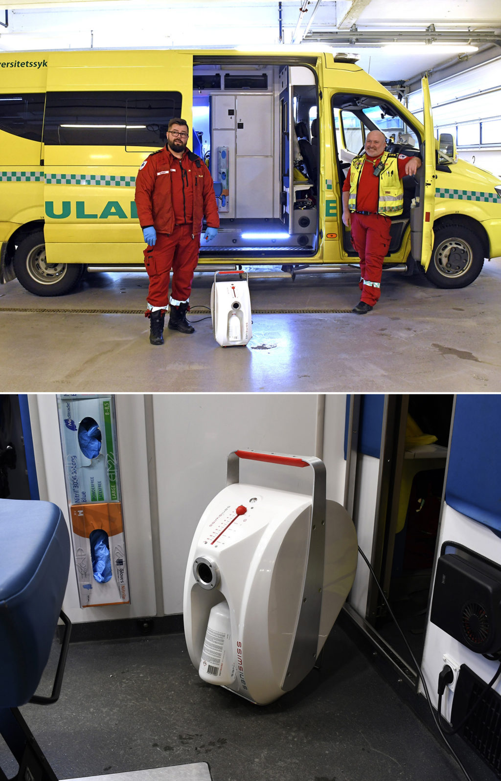 Et par menn i oransje kjeledresser som står ved siden av en hvit maskin