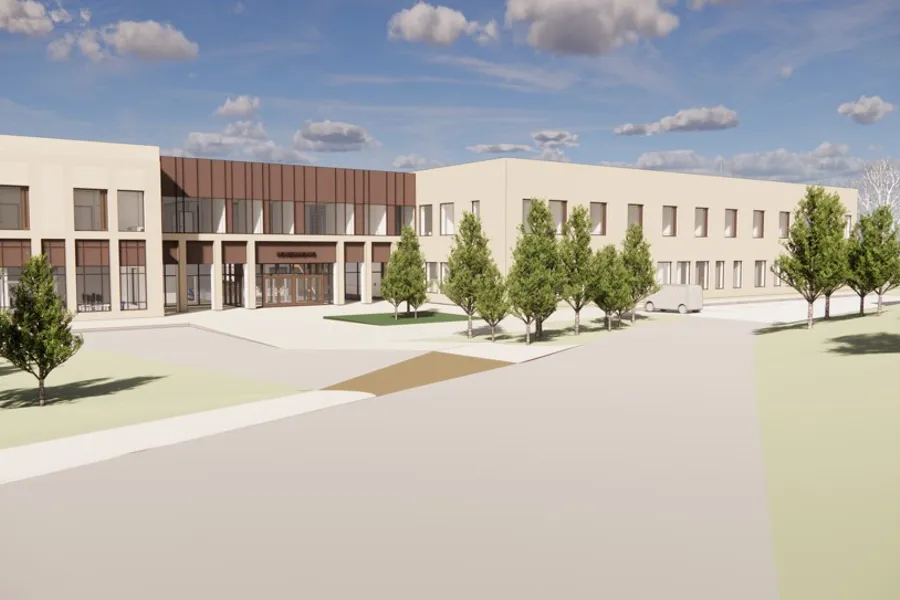 En bygning med trær foran