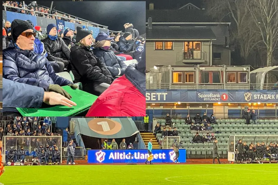 En gruppe mennesker som sitter på en benk på et stadion