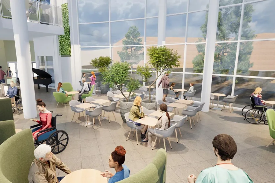 Folk som sitter ved bordene utenfor