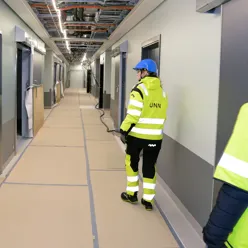 A person in a yellow jacket