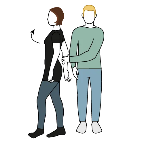 Et par personer iført masker