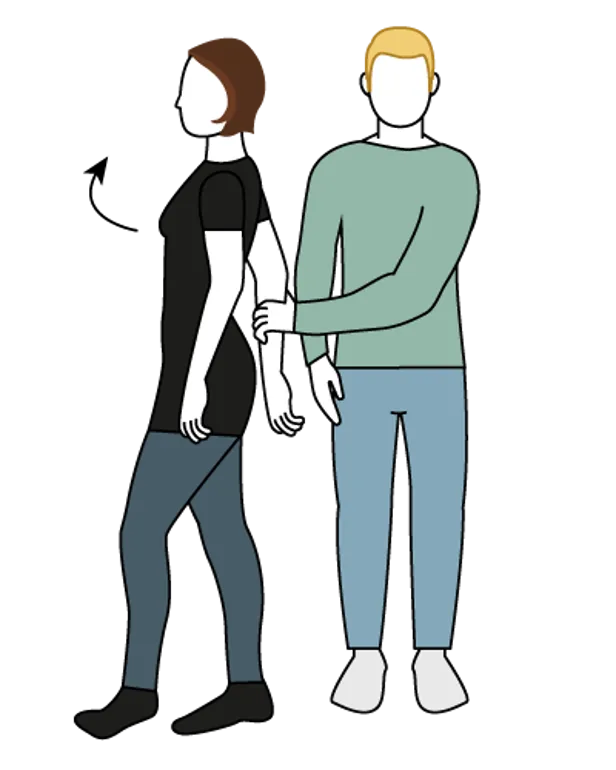 Et par personer iført masker